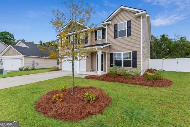 a front view of a house with a yard