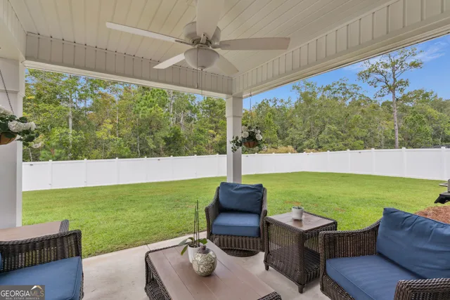 a view of an chairs and table in the patio