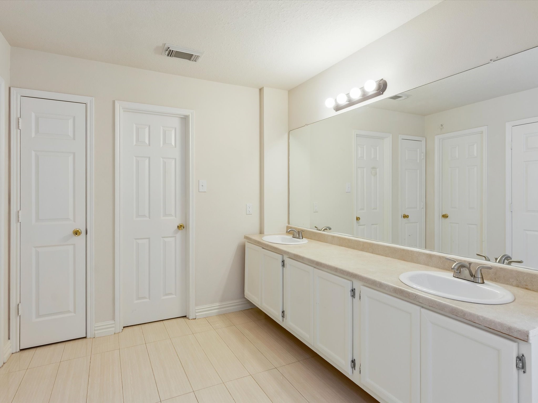 19422 Harvest Stream Way Houston, TX 77084 - Photo 25 of 41 Large double vanity, ample countertop space, and a wide mirror.