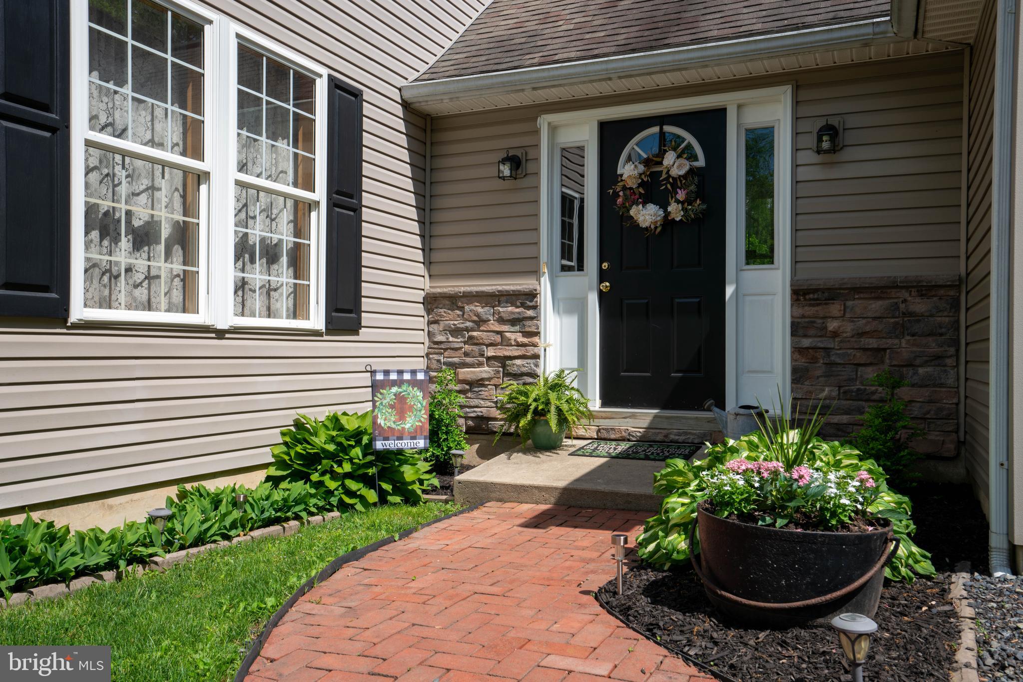 1707 West Rock Road Perkasie, PA 18944 - Photo 4 of 71 Brick Walkway Leads to Breezeway Entrance
