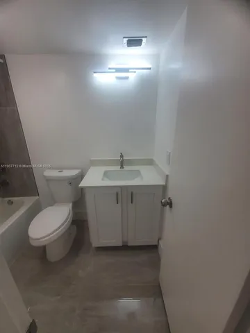 a bathroom with a sink and a toilet