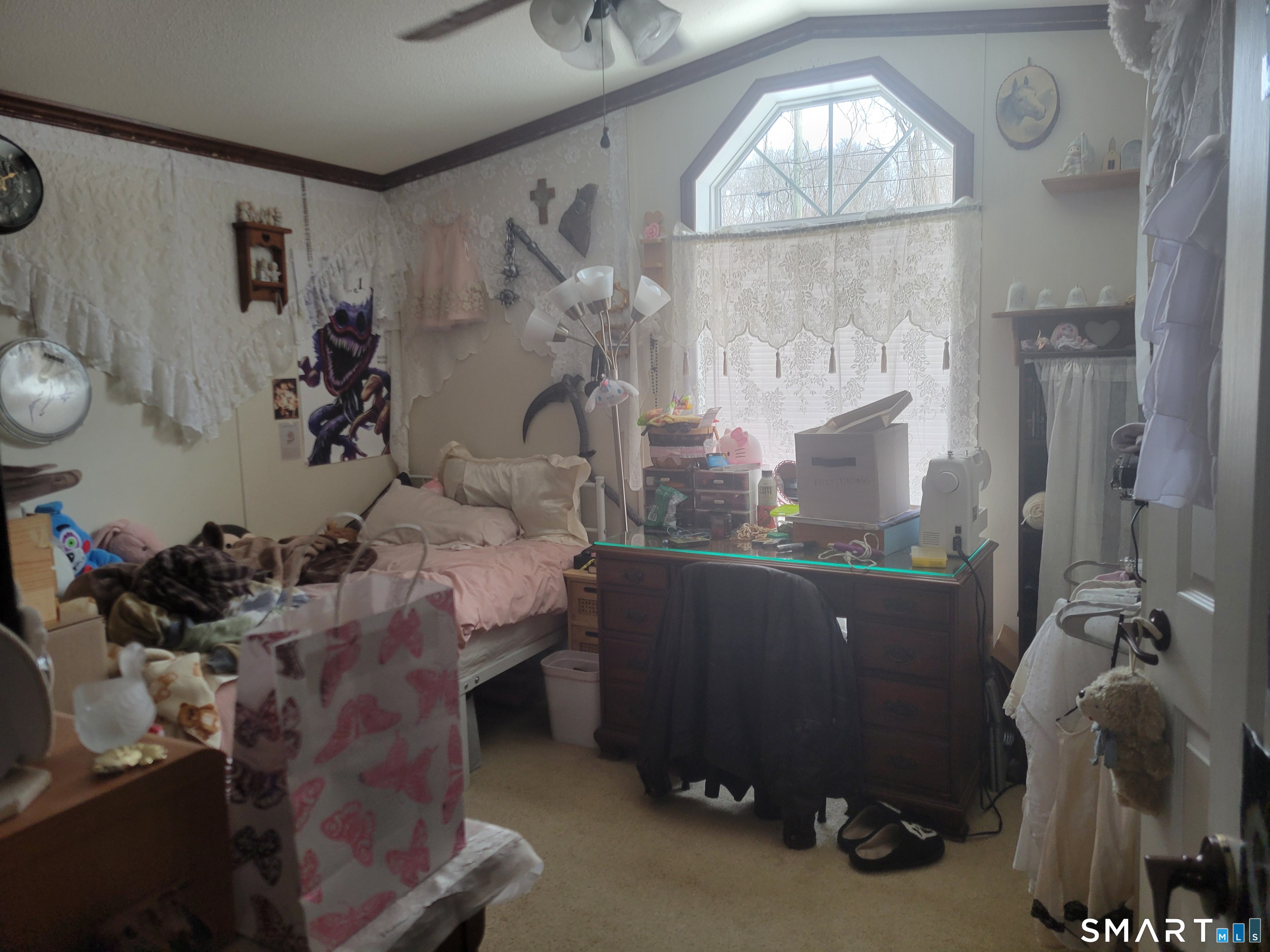 944 Long Cove Road Ledyard, CT 06335 - Photo 8 of 12 a room with a wooden floor and a chandelier