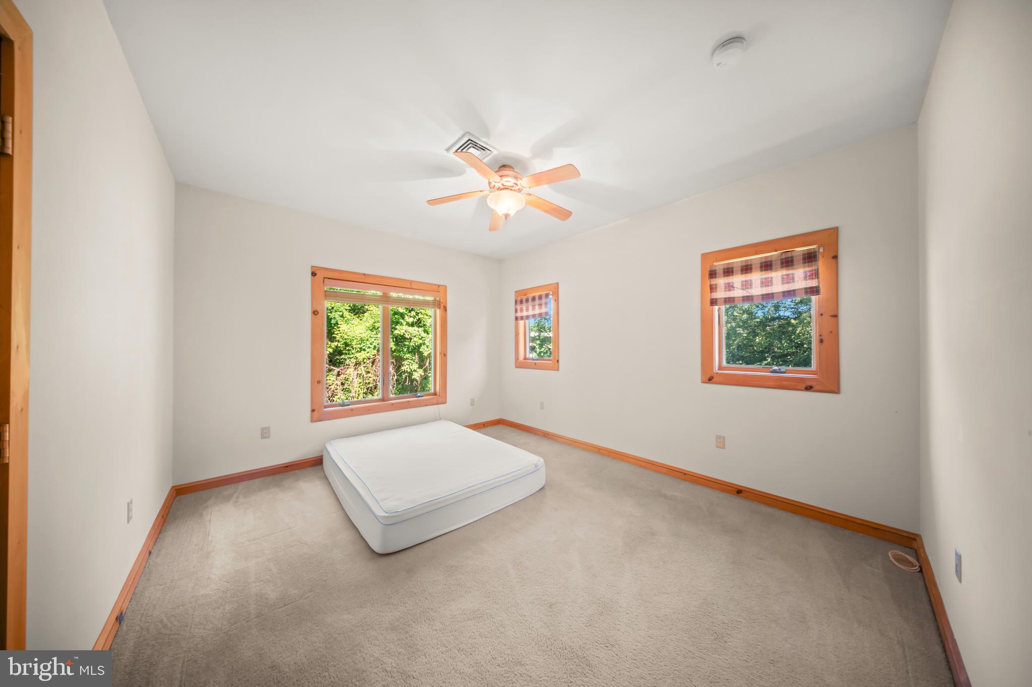 1473 North River Road Yardley, PA 19067 - Photo 34 of 42 an empty room with windows and ceiling fan