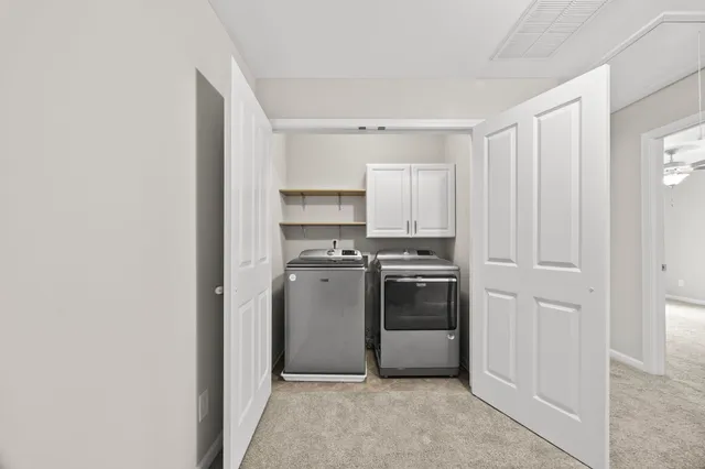 a kitchen with a white stove top oven and sink