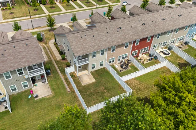 a view of a backyard with seating area