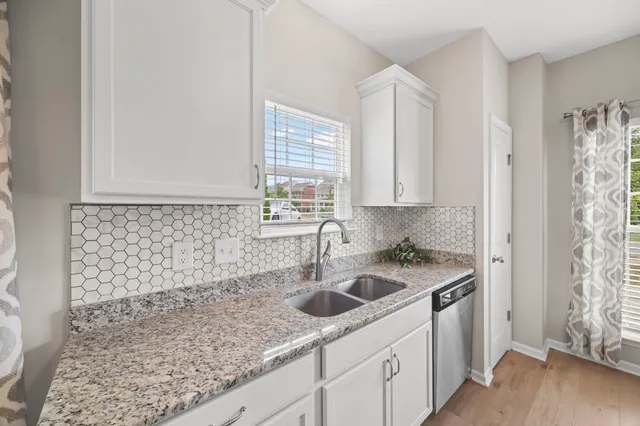a kitchen with a sink and cabinets