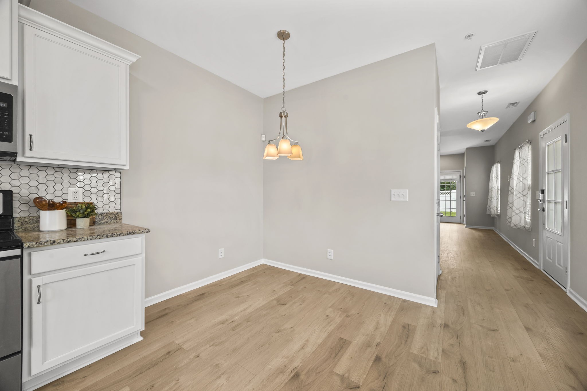 501 Shirebrook Circle Spring Hill, TN 37174 - Photo 8 of 26 a view of a kitchen with a sink cabinets and wooden floor