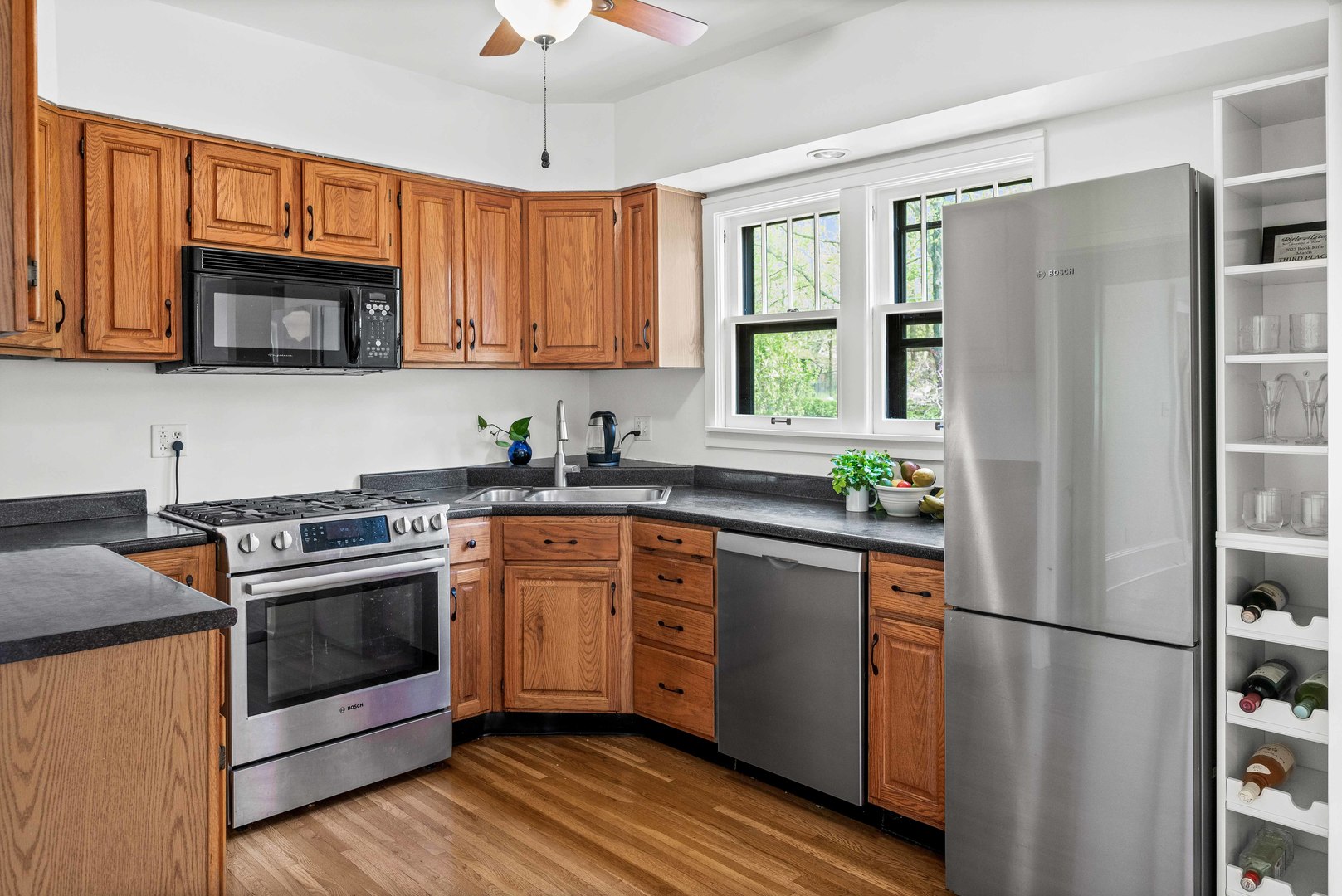 1302 Hillcrest Street Normal, IL 61761 - Photo 11 of 48 a kitchen with stainless steel appliances a refrigerator sink and microwave