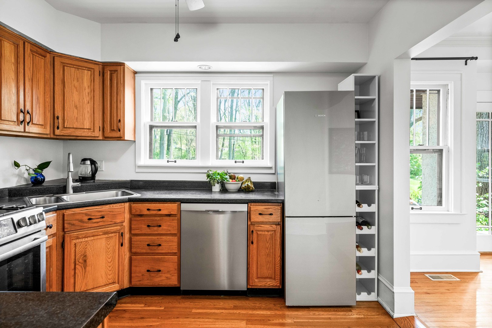 1302 Hillcrest Street Normal, IL 61761 - Photo 13 of 48 a kitchen with stainless steel appliances granite countertop a refrigerator sink and cabinets