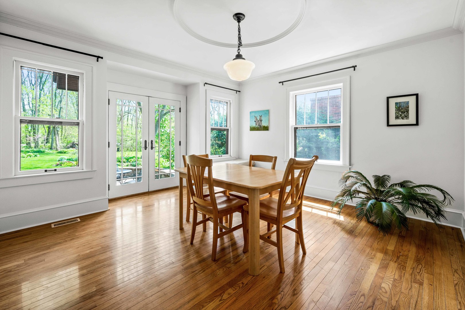 1302 Hillcrest Street Normal, IL 61761 - Photo 15 of 48 a view of a dining room with furniture window and wooden floor