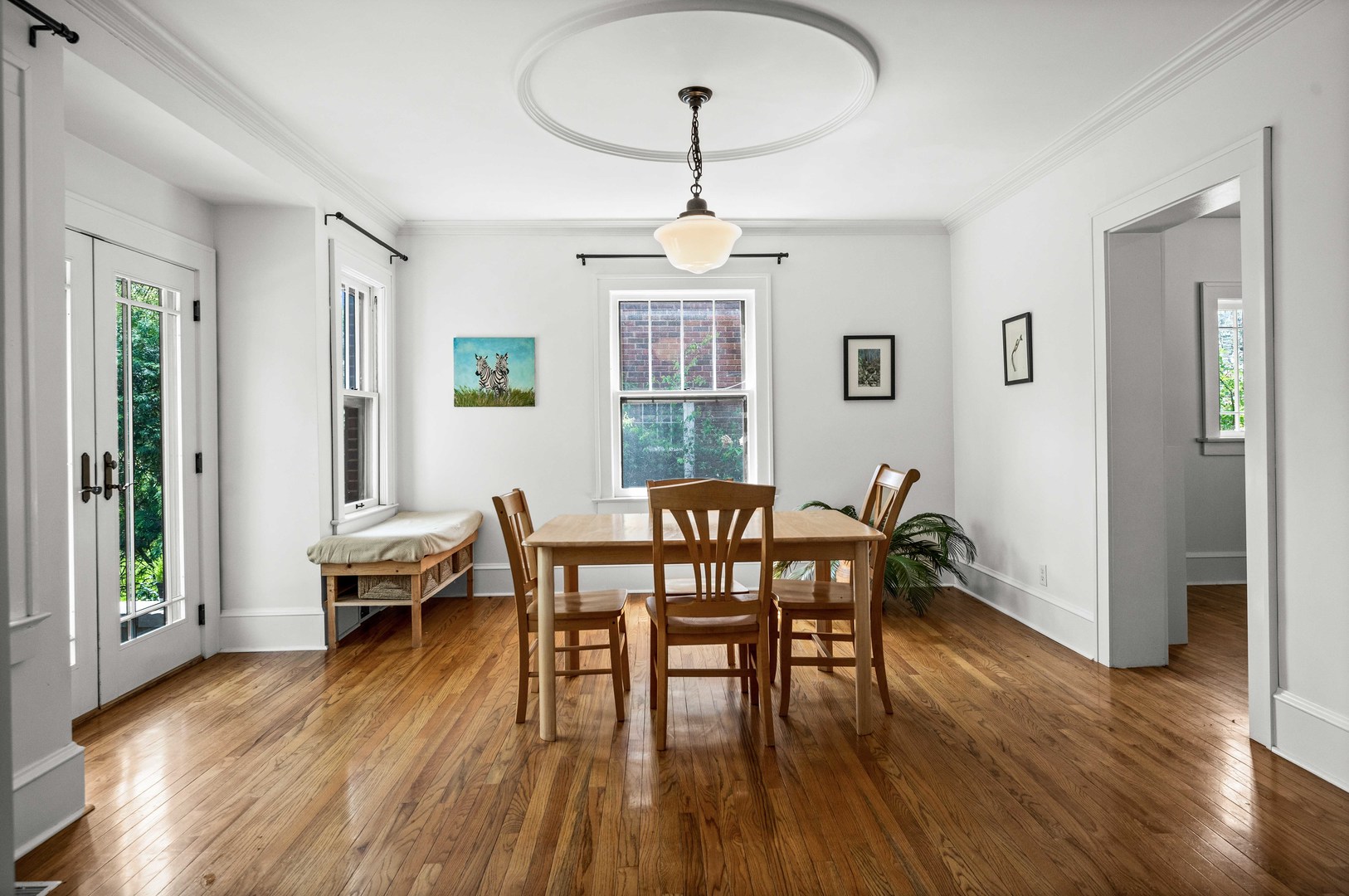 1302 Hillcrest Street Normal, IL 61761 - Photo 16 of 48 a view of a a dining room with furniture window and wooden floor