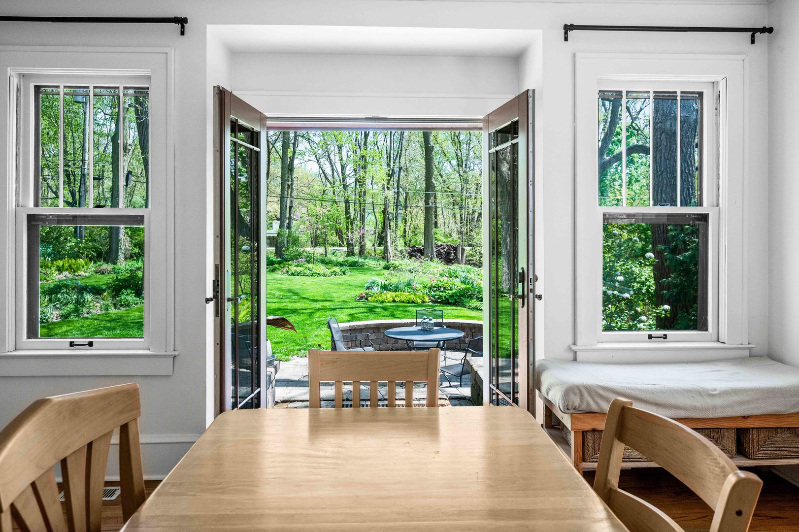 1302 Hillcrest Street Normal, IL 61761 - Photo 18 of 48 a living room with a fireplace dining table and a large window