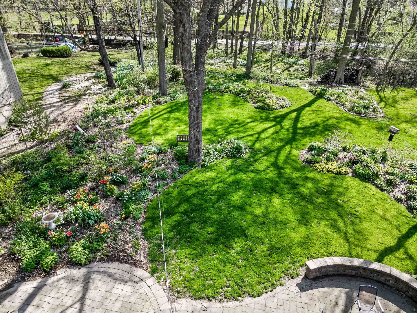 1302 Hillcrest Street Normal, IL 61761 - Photo 44 of 48 a backyard of a house with a yard and outdoor seating