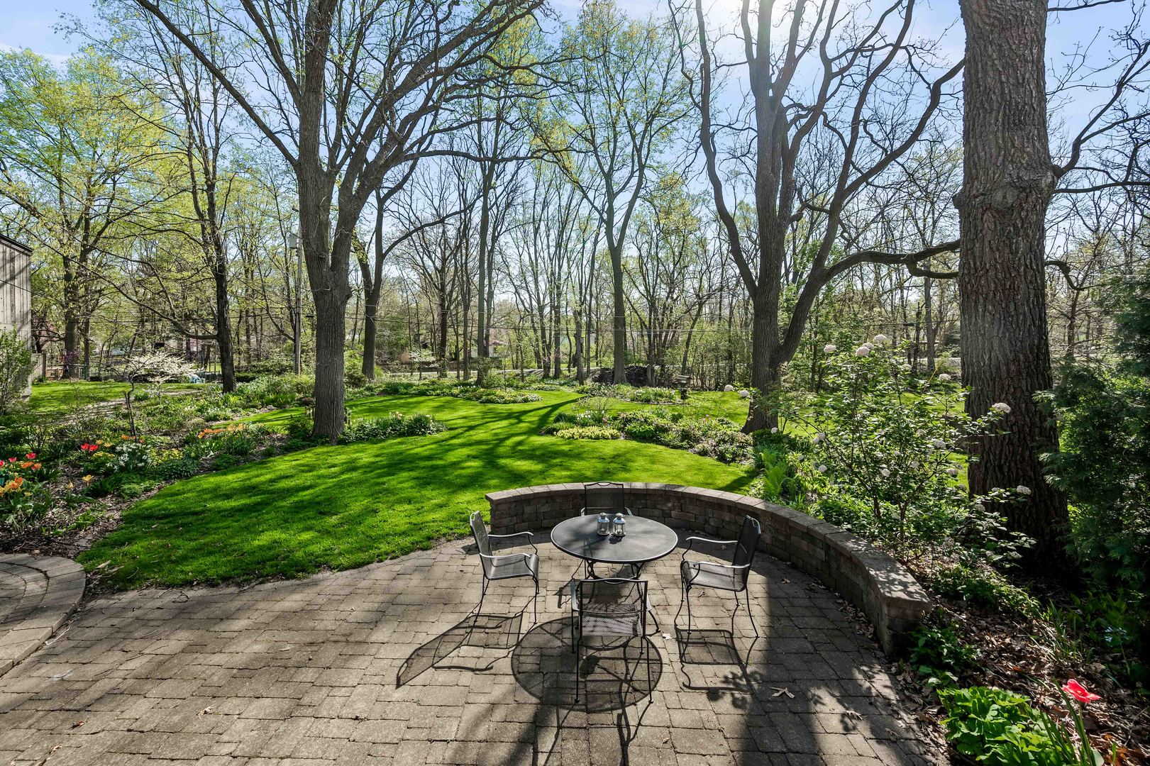 1302 Hillcrest Street Normal, IL 61761 - Photo 46 of 48 a view of backyard with a table and chairs and large trees