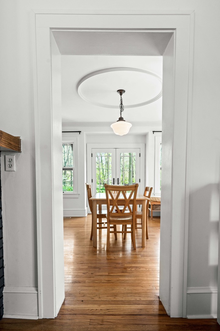 1302 Hillcrest Street Normal, IL 61761 - Photo 9 of 48 a view of a dining room with furniture window and wooden floor
