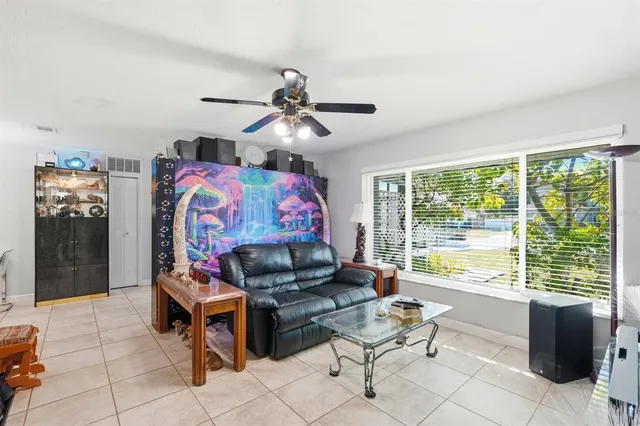 a living room with furniture and a large window