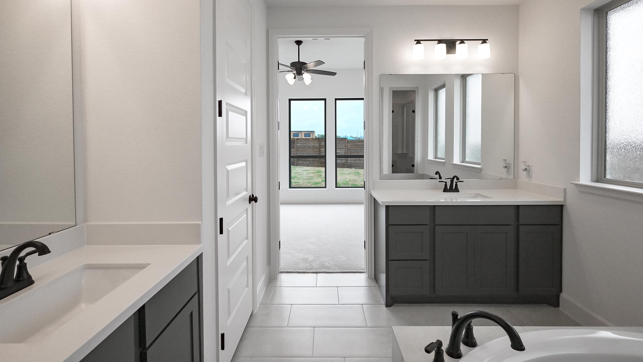 3921 Melody Road Lockhart, TX 78644 - Photo 15 of 30 a bathroom with a sink double vanity
