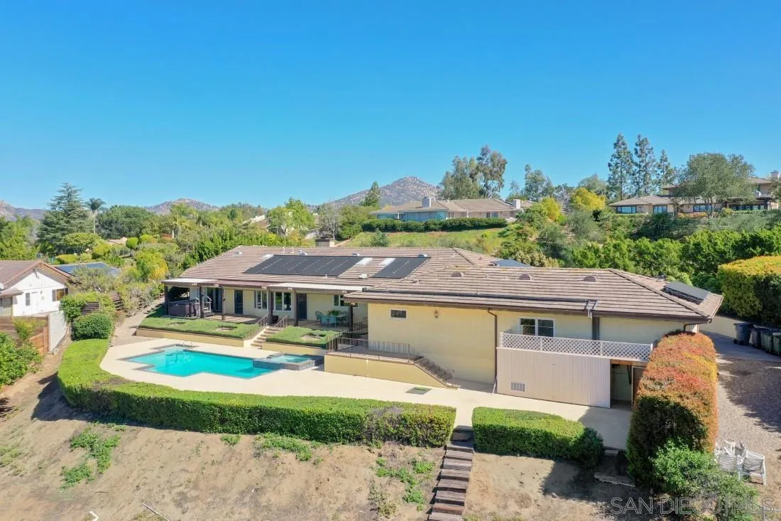 15938 Overview Road Poway, CA 92064 - Photo 12 of 72 an aerial view of a house with swimming pool and a yard
