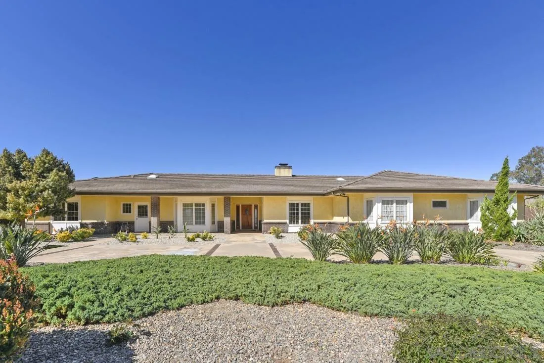 15938 Overview Road Poway, CA 92064 - Photo 18 of 72 a front view of a house with a yard