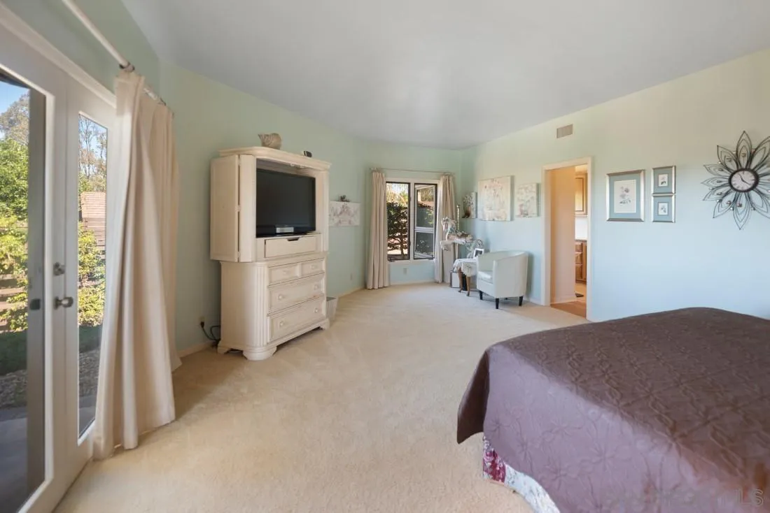 15938 Overview Road Poway, CA 92064 - Photo 29 of 72 a bedroom with a bed and a television