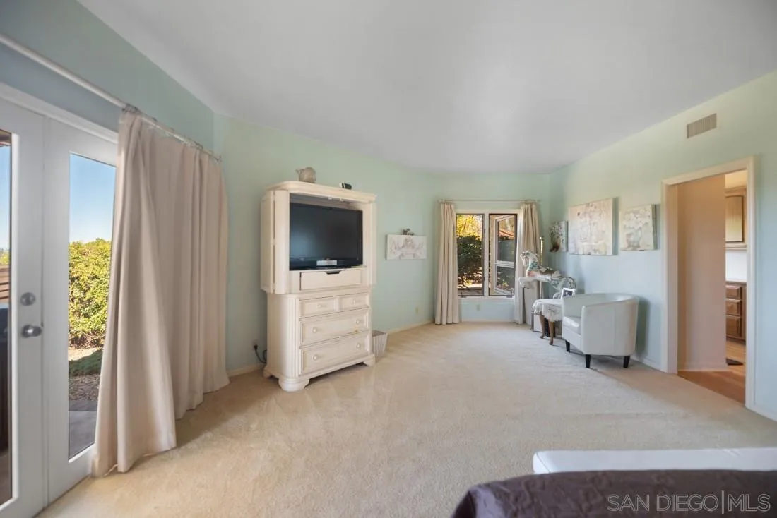 15938 Overview Road Poway, CA 92064 - Photo 30 of 72 a living room with furniture and a flat screen tv