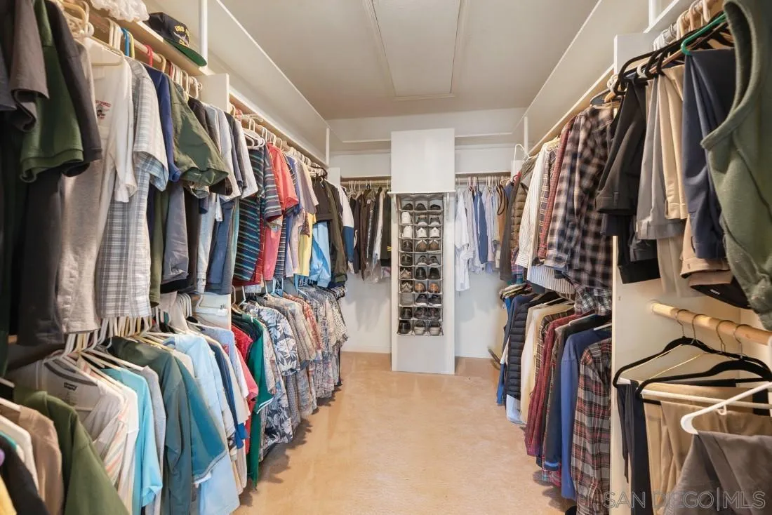 15938 Overview Road Poway, CA 92064 - Photo 34 of 72 a view of walk in closet with clothes