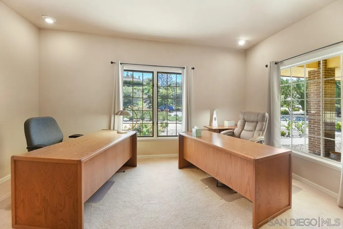 15938 Overview Road Poway, CA 92064 - Photo 41 of 72 a large bedroom with a large window and a couch