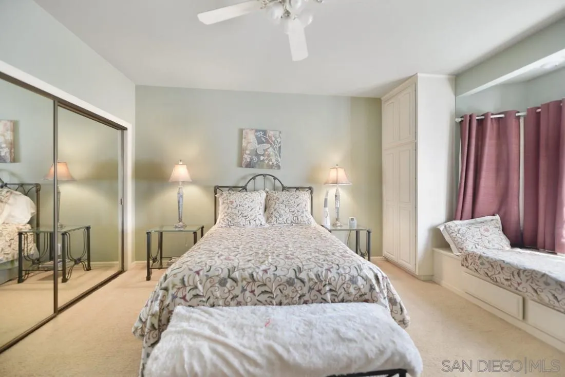 15938 Overview Road Poway, CA 92064 - Photo 46 of 72 a bedroom with a large bed and a chandelier