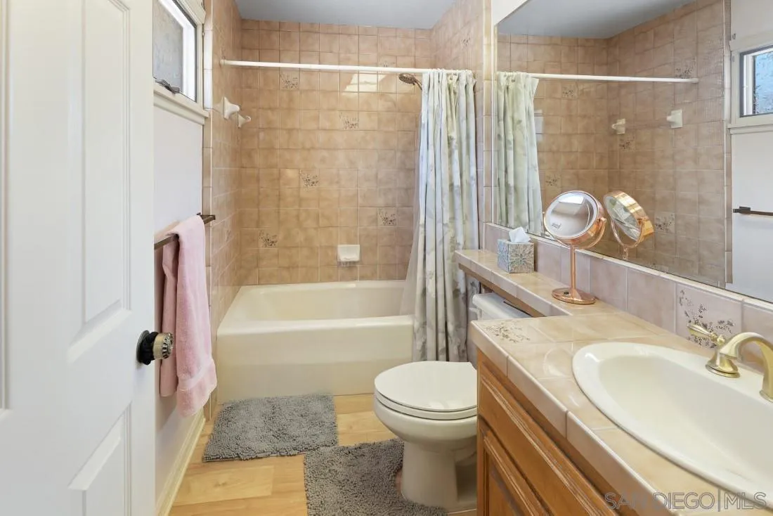 15938 Overview Road Poway, CA 92064 - Photo 58 of 72 a bathroom with a sink toilet and shower