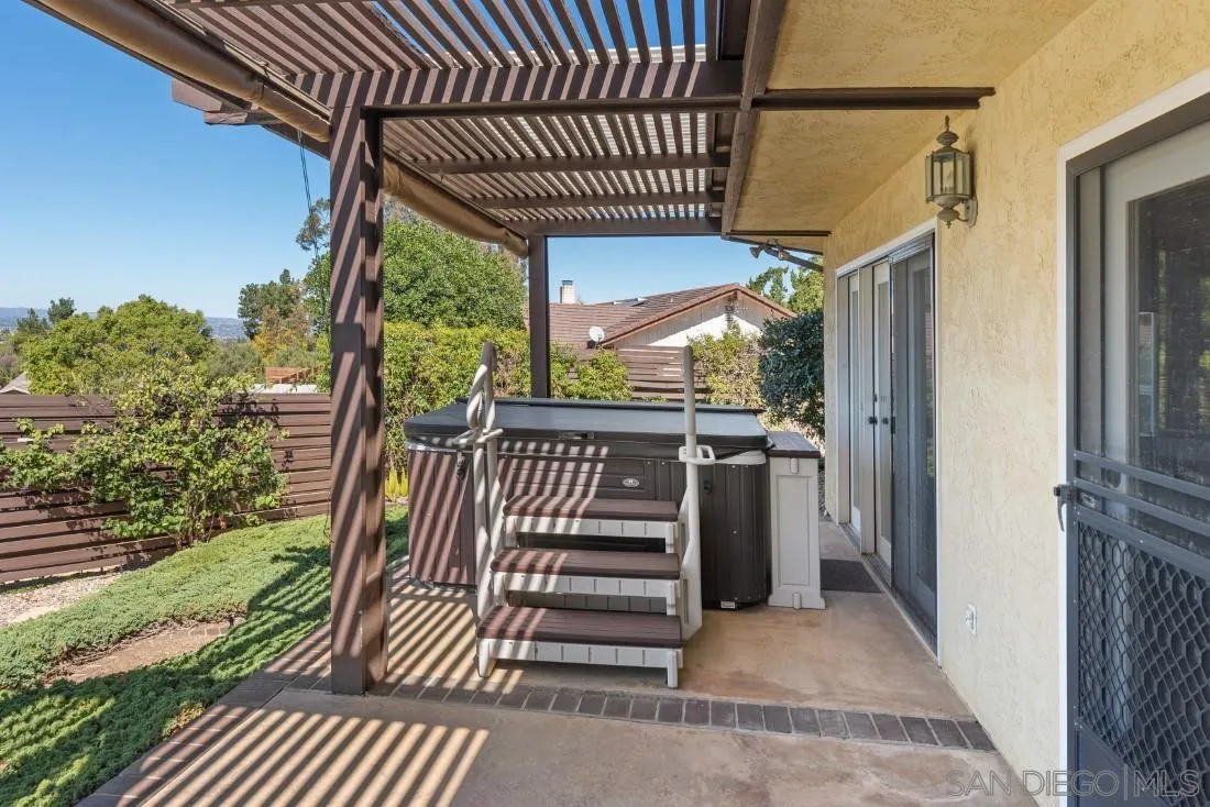15938 Overview Road Poway, CA 92064 - Photo 66 of 72 a view of a porch with furniture and a yard