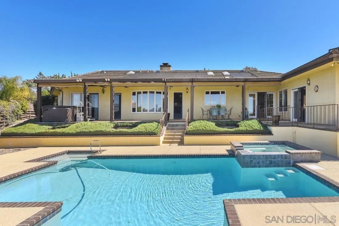 15938 Overview Road Poway, CA 92064 - Photo 72 of 72 a view of a house with swimming pool and a chairs