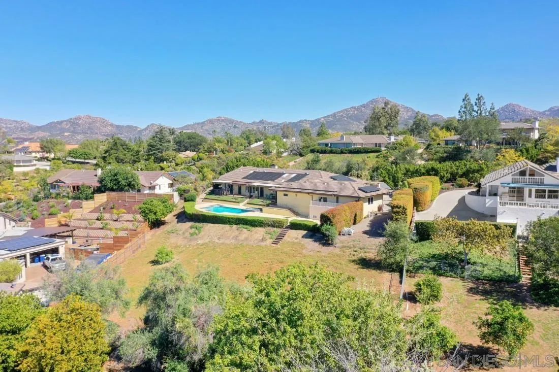 15938 Overview Road Poway, CA 92064 - Photo 8 of 72 a view of backyard of residential houses with outdoor space and swimming pool
