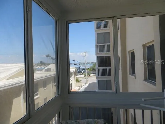 a view of wooden floor and a window