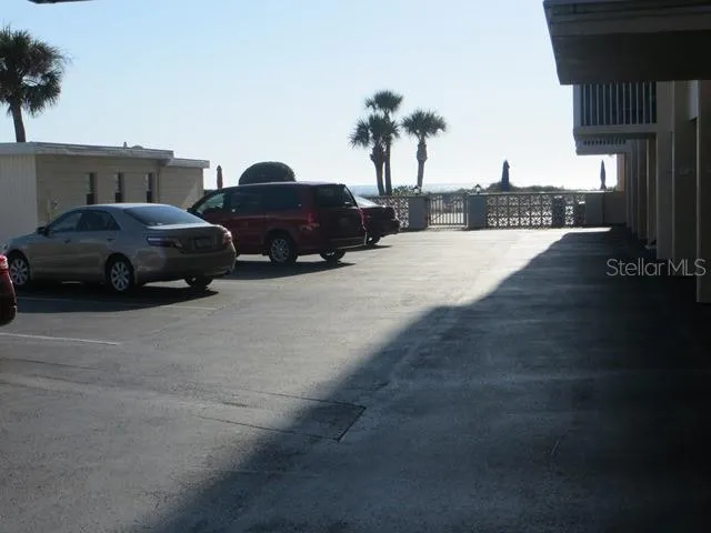 a view of street with parked cars