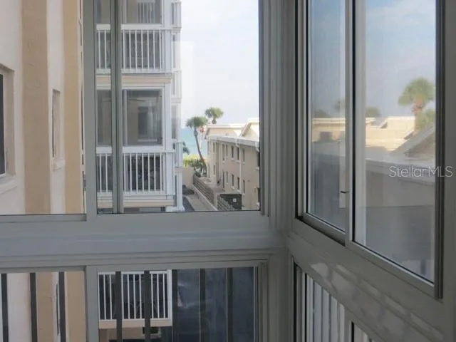 a view of balcony with wooden floor