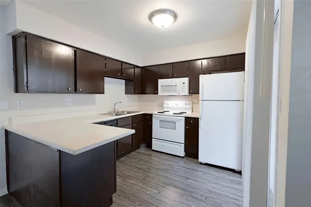 a kitchen with a sink and a stove