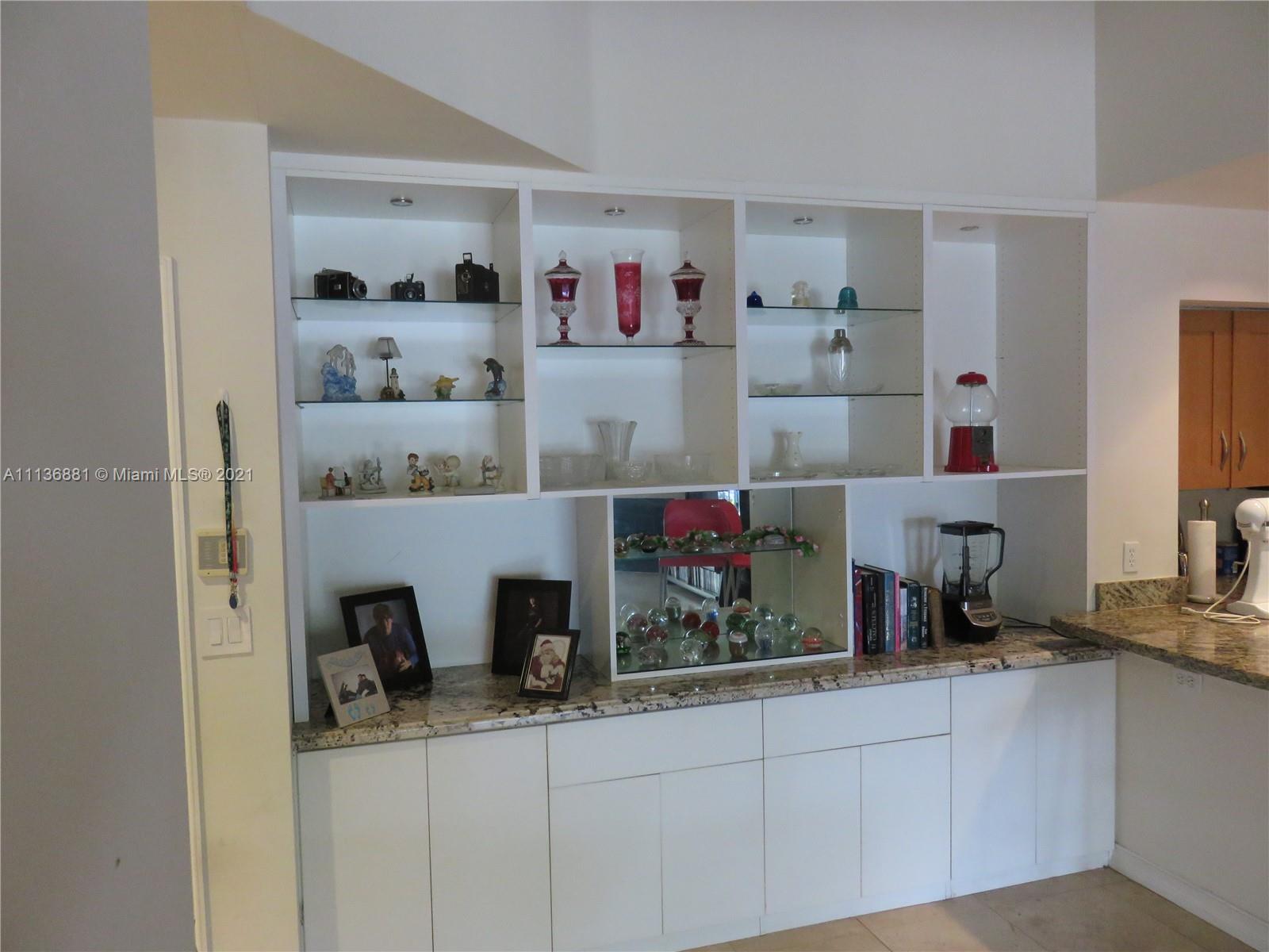 3237 Clint Moore Road, Unit 204 Boca Raton, FL 33496 - Photo 6 of 13 a room with furniture and wooden floor