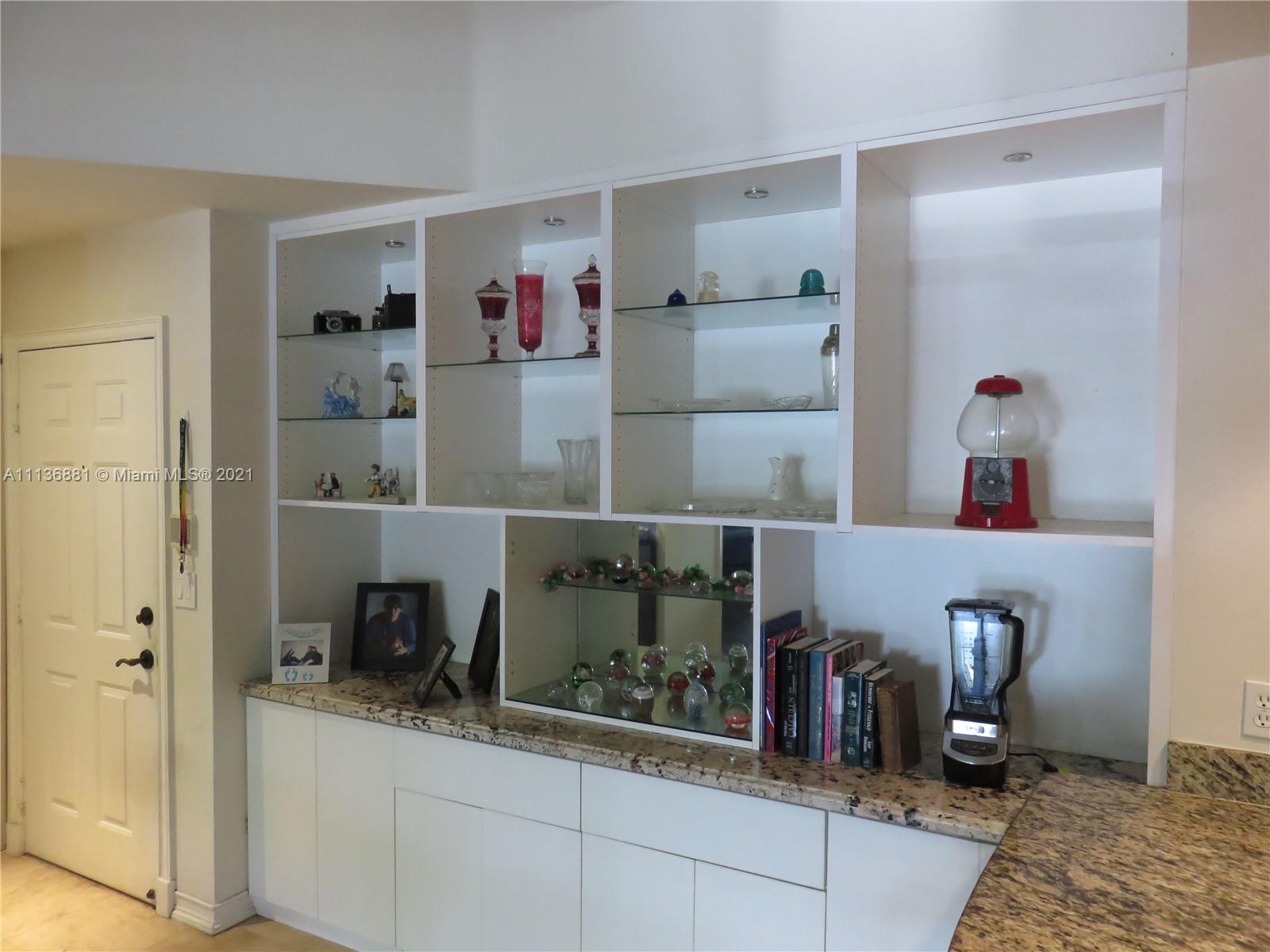3237 Clint Moore Road, Unit 204 Boca Raton, FL 33496 - Photo 7 of 13 a kitchen with sink and refrigerator