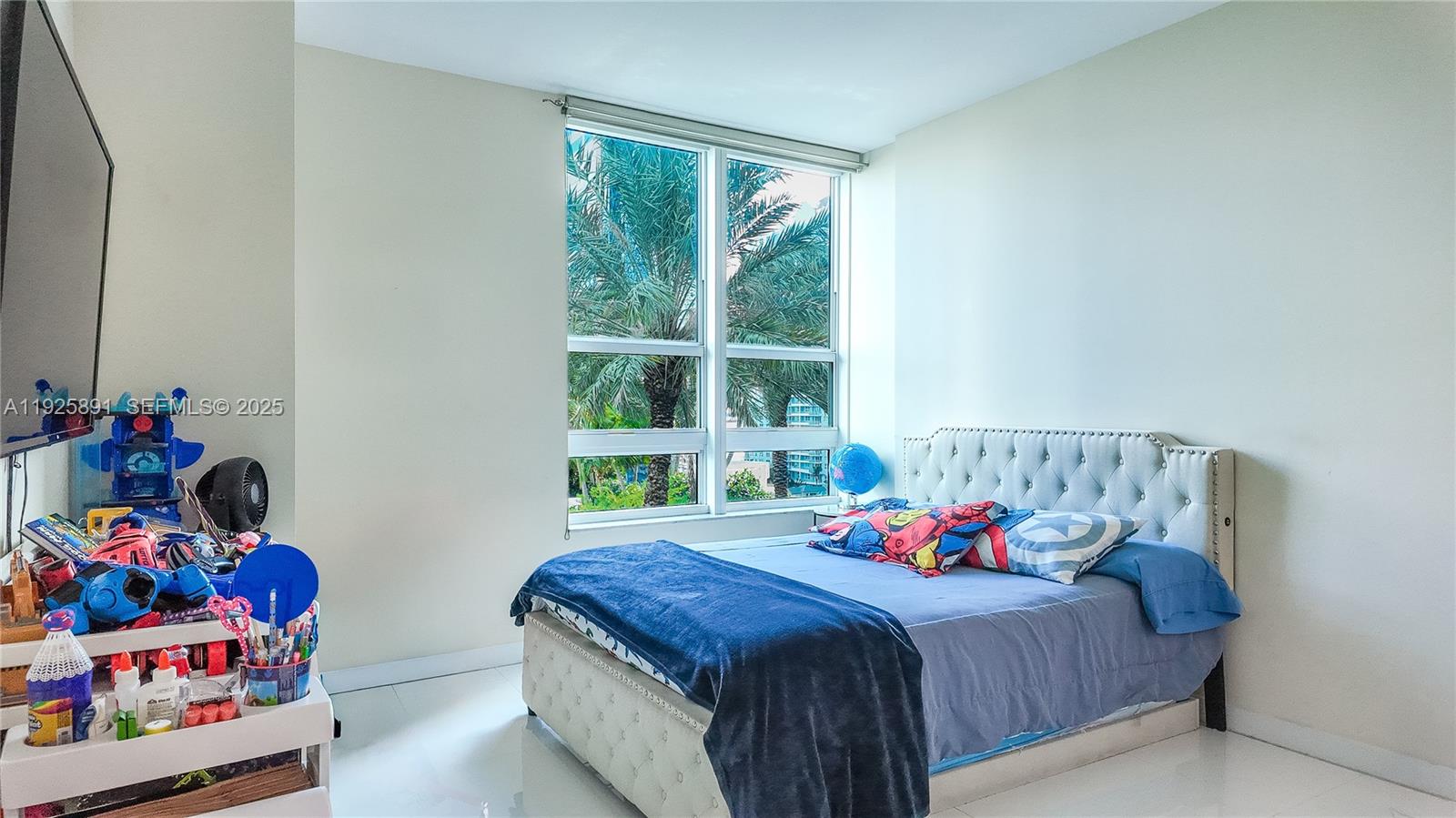 951 Brickell Avenue, Unit 1206 Miami, FL 33131 - Photo 9 of 12 a bedroom with bed and a window