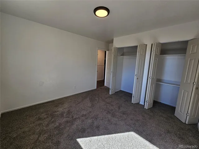 a view of a livingroom with a refrigerator