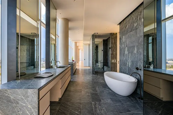 a lobby with furniture and large windows