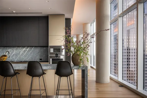 a kitchen with a table and chairs