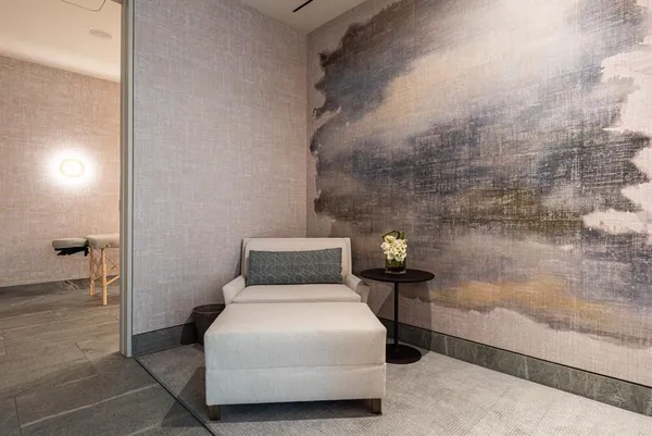 a bedroom with a bed and a table