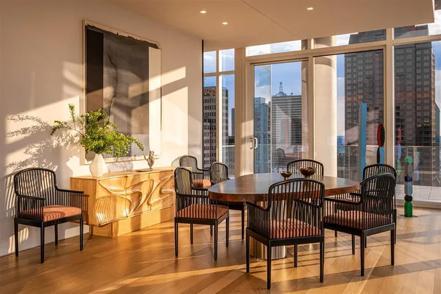 a view of a dining room with furniture window and outside view