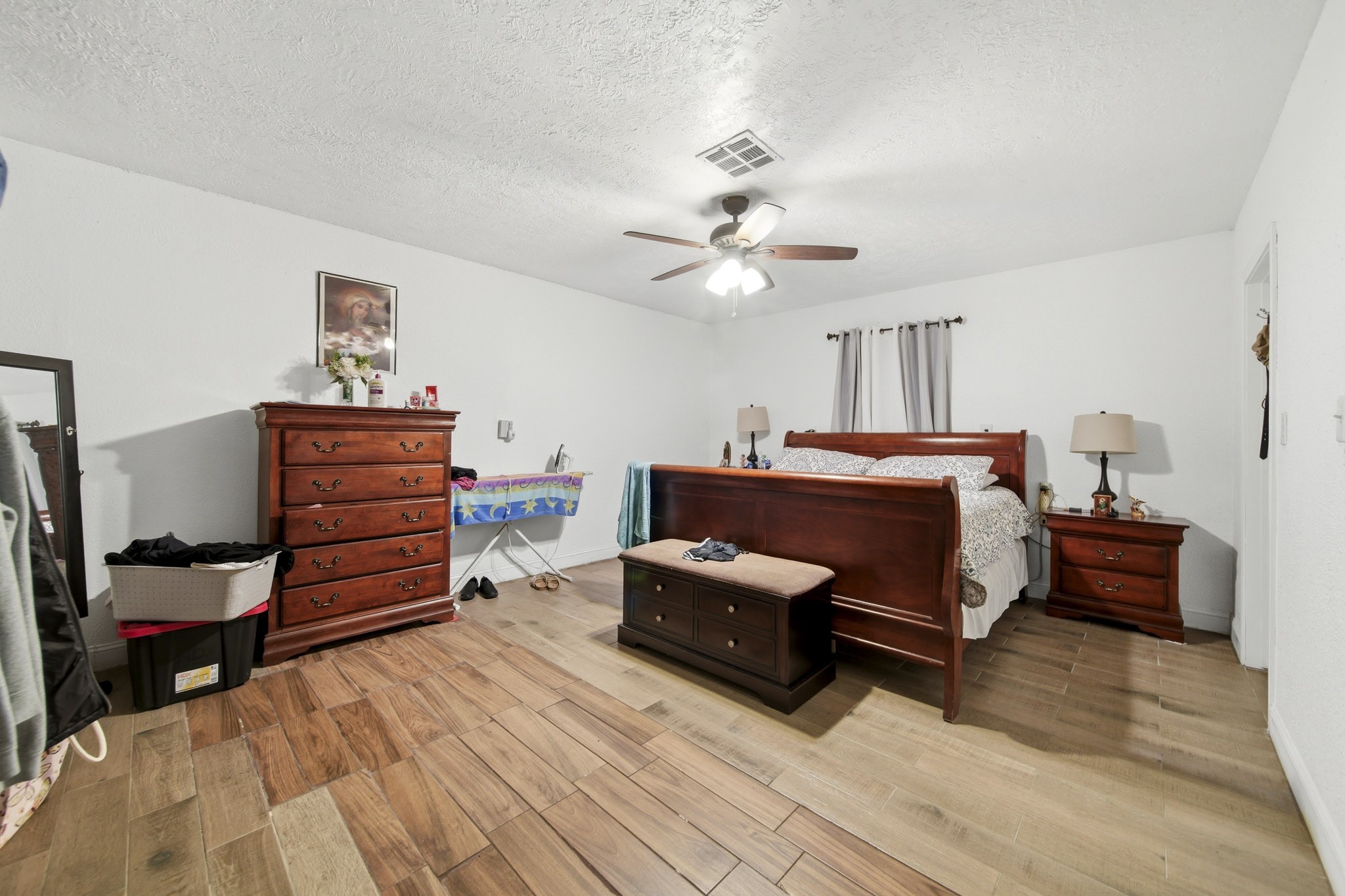 731 Meneley Road Winnie, TX 77665 - Photo 17 of 27 a bedroom with a bed and furniture