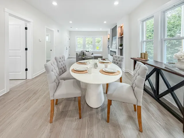 a view of a dining room with furniture window and wooden floor