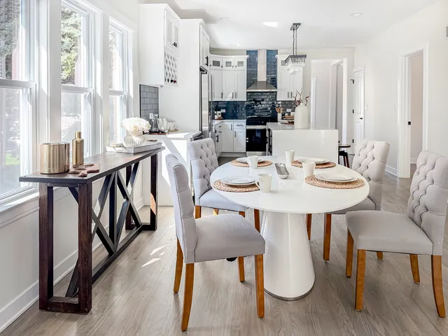 a view of a dining room with furniture window and wooden floor
