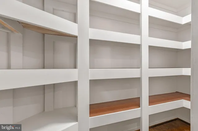 a large kitchen with granite countertop a sink and dishwasher wooden cabinets with a granite countertops