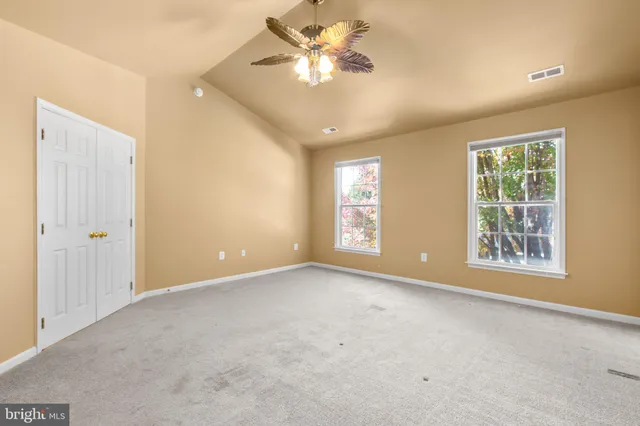 a bathroom with a toilet a sink and a mirror
