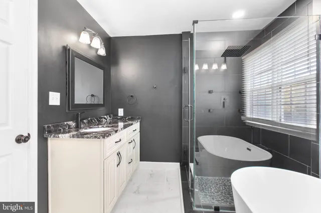 a view of empty room with wooden floor and windows